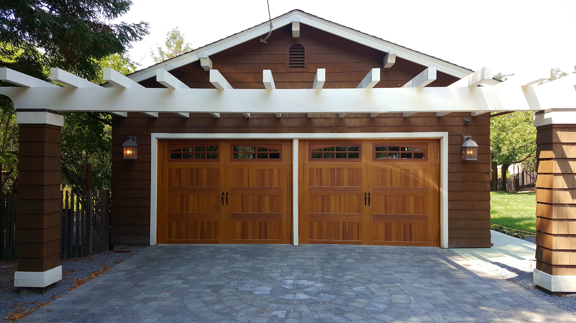Wood carriage-style garage doors from the client-provided portfolio photo